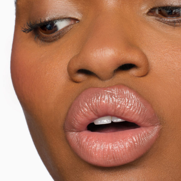 Model applying Futurelipstick Deluxe Shine