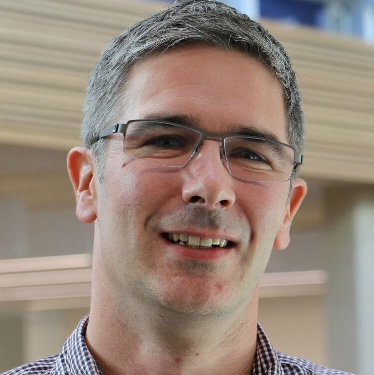 A photo of Dr Iain Turnball smiling at the camera.